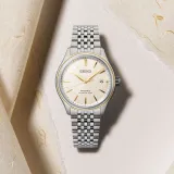 Seiko Presage Automatikuhr silberfarben goldfarbene Akzente Zifferblatt beige SPB478J1